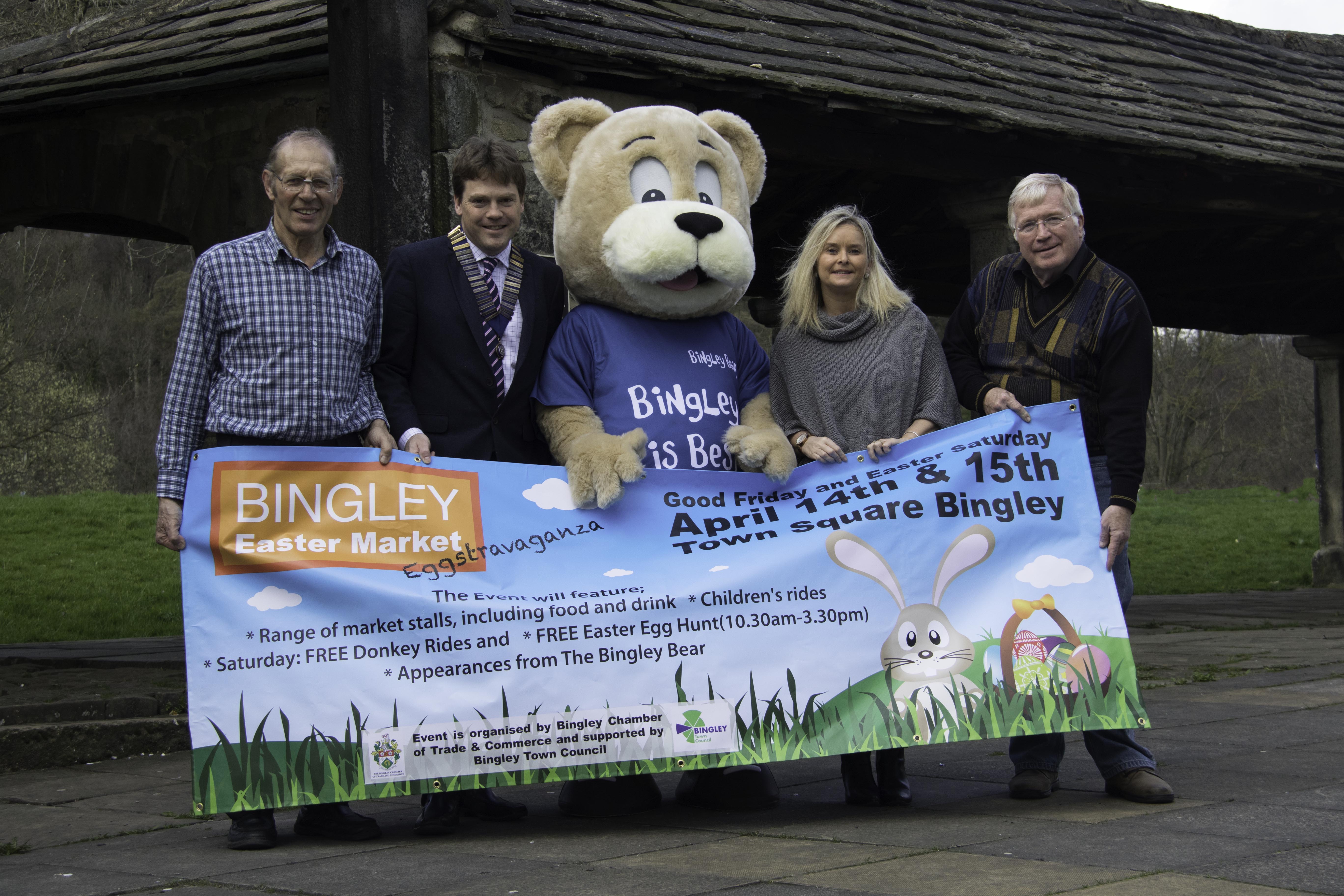 L to R: Cllr John Goode, Jamie Illingworth, President of Bingley Chamber of Trade and Commerce, Bingley Bear, Cllr Michelle Chapman and Cllr Mark Truelove with the banner promoting the Bingley Easter Market.