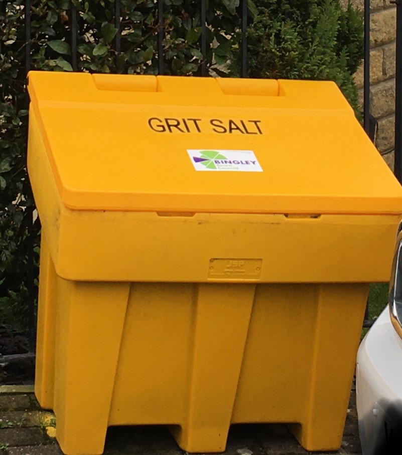 Picture of grit bin with the green and purple logo of Bingley town council on it